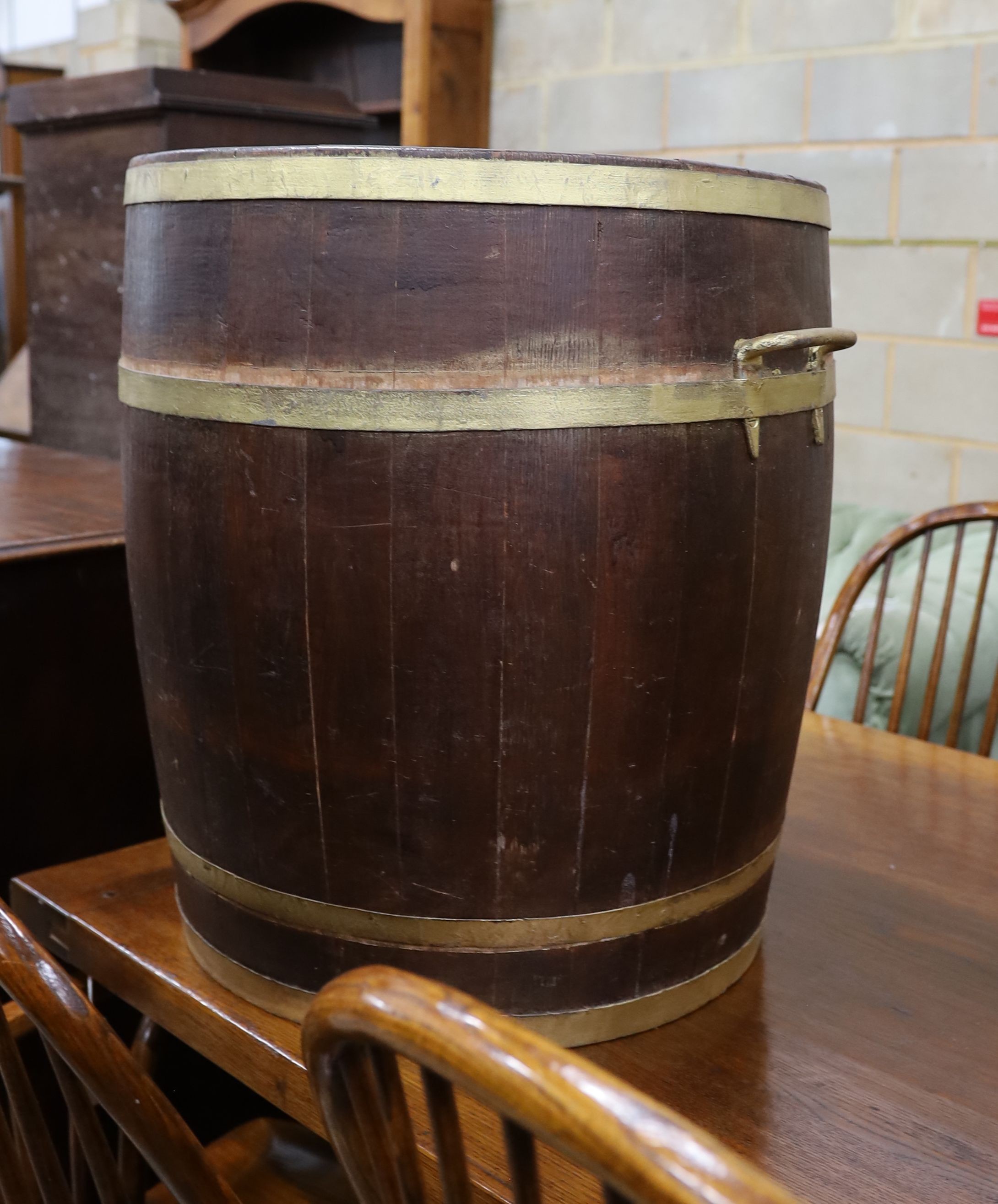 A large brass bound staved oak tub, diameter 54cm, height 61cm